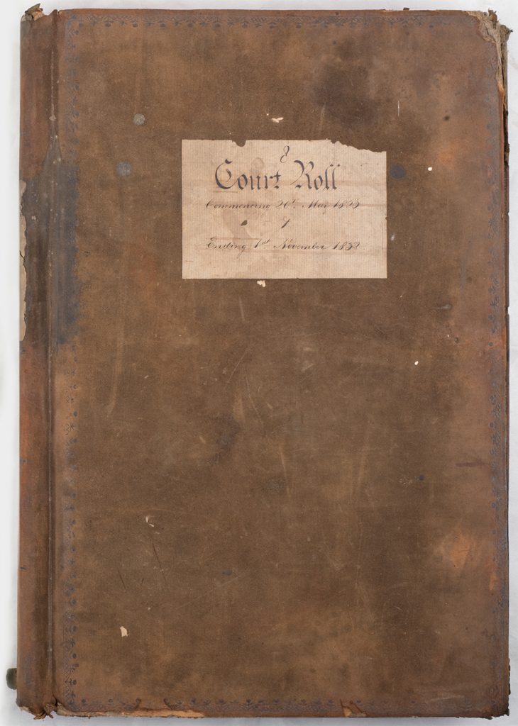 Photograph of closed bound book of court records