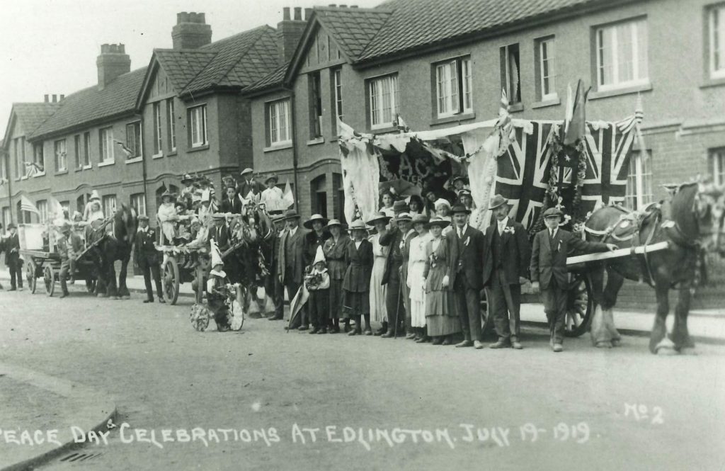 black and white photograph of a street parade